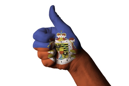 Hand with thumb up gesture in colored liechtenstein national flag as symbol of excellence, achievement, good, - useful for tourism and touristic advertising and also current positive political, cultural, social management of state or countryの写真素材