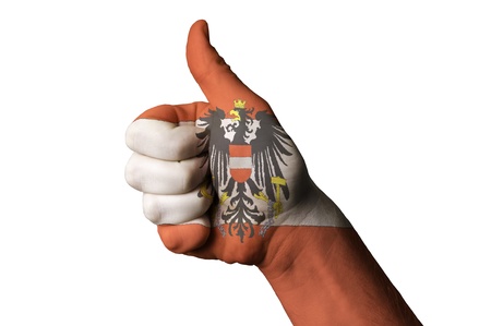 Hand with thumb up gesture colored in austria national flag as symbol of excellence, achievement,...