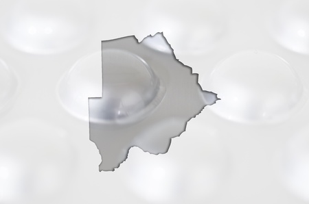 Outline botswana map with transparent background of capsules symbolizing pharmacy and medicineの写真素材