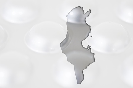 Outline tunisia map with transparent background of capsules symbolizing pharmacy and medicineの写真素材