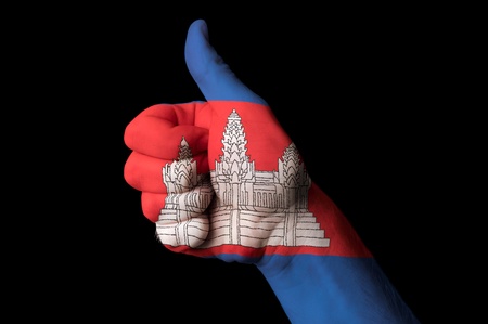 Hand with thumb up gesture in colored cambodia national flag as symbol of excellence, achievement, good, - for tourism and touristic, advertising, positive political, cultural, social management of countryの写真素材