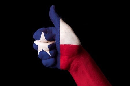 Hand with thumb up gesture in colored texas usa state flag as symbol of excellence, achievement, good, - for tourism and touristic advertising, positive political, cultural, social management of countryの写真素材