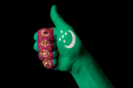 Hand with thumb up gesture in colored turkmenistan national flag as symbol of excellence, achievement, good, - for tourism and touristic advertising, positive political, cultural, social management of countryの写真素材