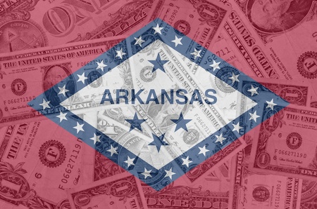 transparent united states of america state flag of arkansas with dollar currency in background symbolizing political, economical and social governmentの写真素材