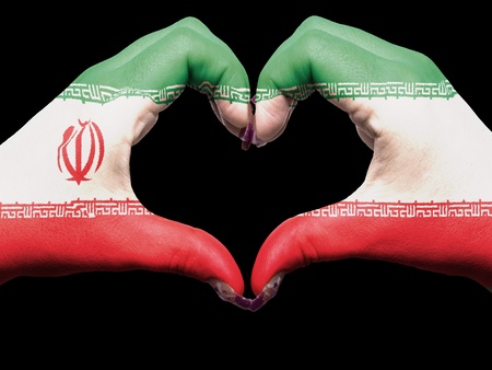 Tourist made gesture  by iran flag colored hands showing symbol of heart and loveの写真素材