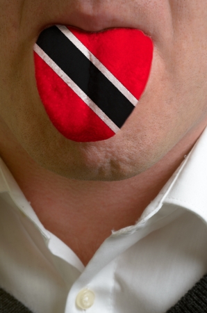 man wit open mouth spreading tongue colored in tunisia flag as symbol of values like teaching, learning, multilingual speaking different of languagesの写真素材