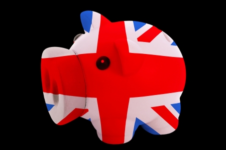 piggy rich bank in colorsnational flag of ukfor saving money on black backgroundの写真素材