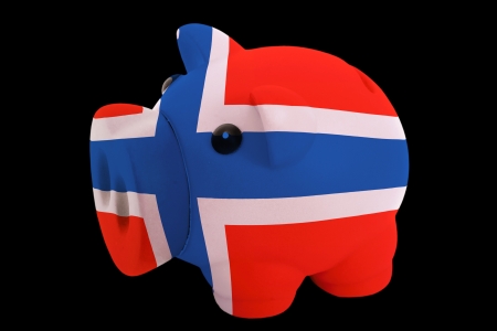 piggy rich bank in colorsnational flag of norwayfor saving money on black backgroundの写真素材