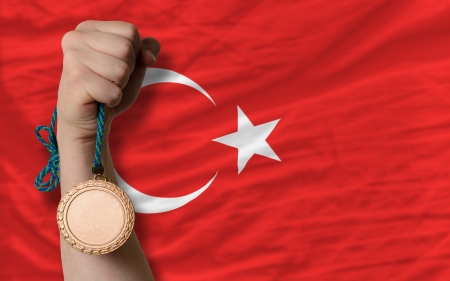Holding bronze medal for sport and national flag of turkeyの写真素材