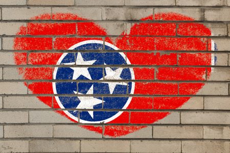 heart shaped flag in colors of tennessee on brick wallの写真素材