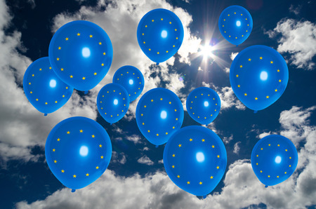 many ballons in colors of europe flag flying on skyの写真素材