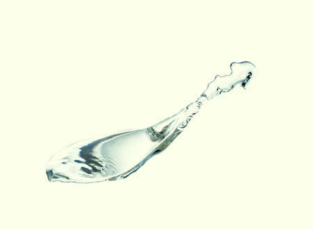 splashing water with bubbles isolated on white の写真素材