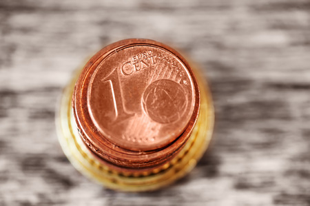 stack of european currency. closeup 1 euro cent. finance concept