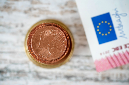 stack of european currency. closeup 1 euro cent. finance concept