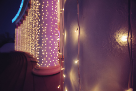 Christmas decoration on building with garland. vintage  picture with soft focusの写真素材