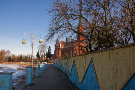 Catholic church on the river bankの写真素材