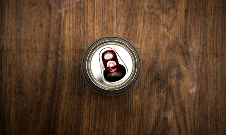 Tin can with beer on the background of wood texture, drink