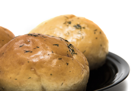 Three rolls on a plate on a white background, isolate