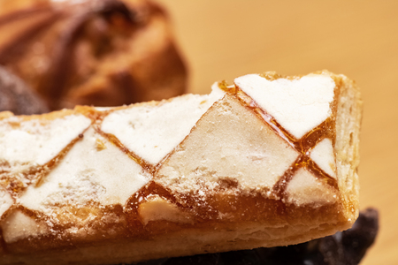 Cake with cream and icing close up with copy spaceの写真素材