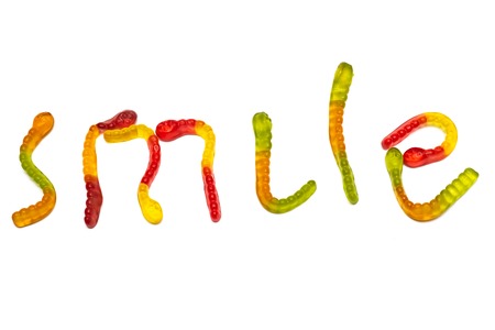The word smile of marmalade worms, isolate on a white background