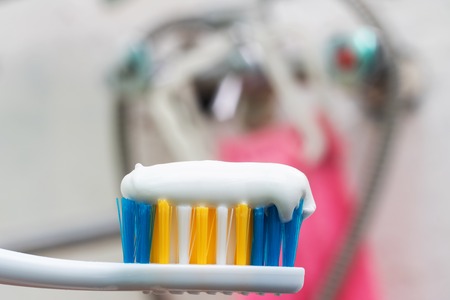 Tooth brush and white toothpaste close up with copy spaceの写真素材