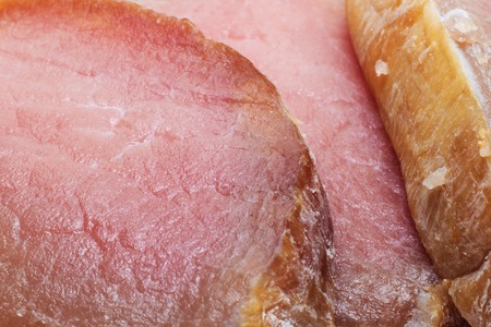 Slices of juicy red meat close up, background or textureの写真素材