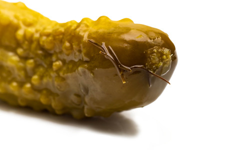 Green pickled cucumber closeup, isolate on white backgroundの写真素材