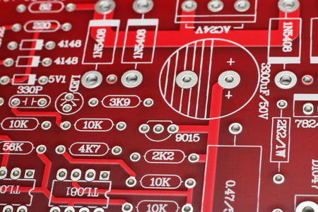 Tracks on a circuit board close up, macro photo, background or texture