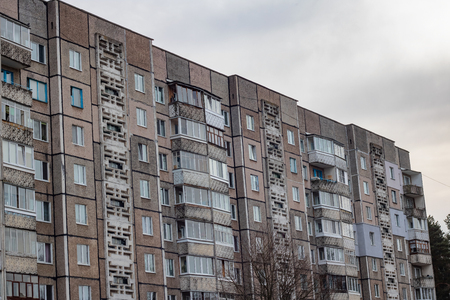 High old residential building in Russia close up against the sky with cloudsの写真素材