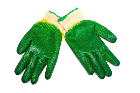 Green rubber gloves close up, isolate on a white backgroundの写真素材