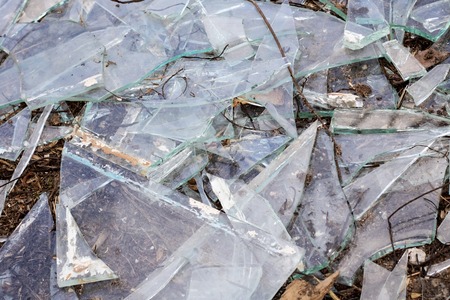 Broken glass shards close up, texture or backgroundの写真素材