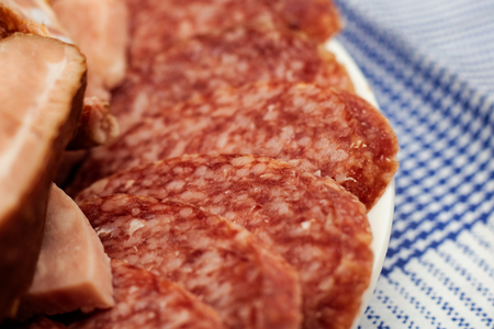 Slices of red smoked sausage close upの写真素材
