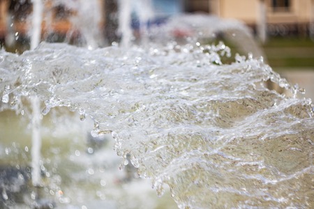 Drops of water in the fountain close up