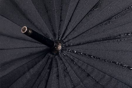 Big black umbrella top view close up, with copy spaceの写真素材