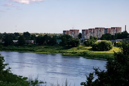 Houses of a small town by the river in summer