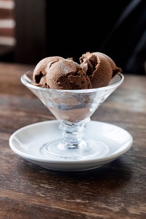 Chocolate ice cream balls in a vase close up