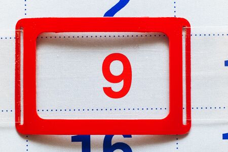 White calendar with a marked date ninth close upの写真素材