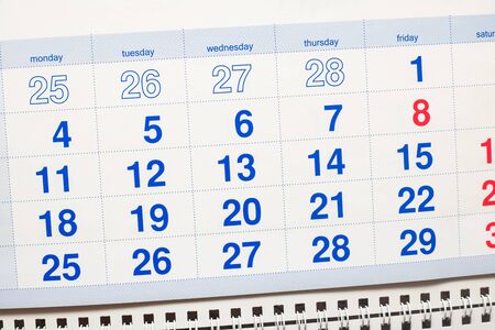 White calendar for the month close up with blue numbersの写真素材