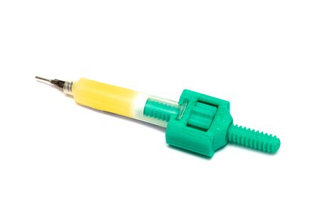 Syringe with soldering liquid isolated on white backgroundの写真素材