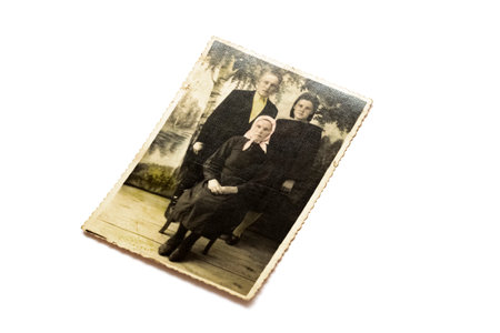 BELARUS, NOVOPOLOTSK - NOVEMBER 03, 2019: Old photo of a man and two women isolated on white...