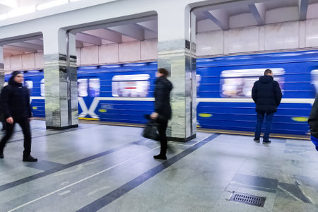 BELARUS, MINSK - DECEMBER 03, 2019: Train and people in the subway in motionのeditorial素材