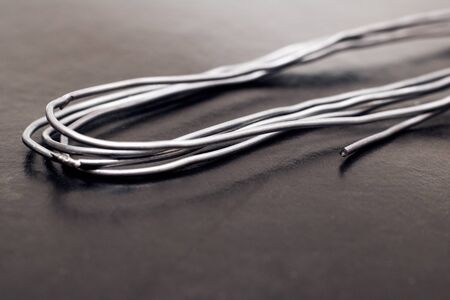 Twisted skein of wire on black backgroundの写真素材