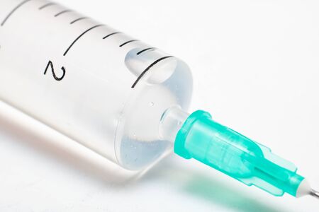 Syringe with medicine on a white background close upの写真素材