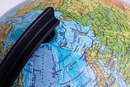 Greenland island on a globe map close up