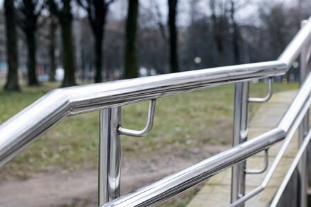 Metal railing stairs in the park in autumnの写真素材