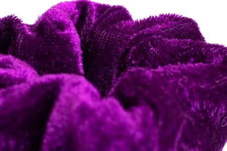 Big violet elastic band for hair isolated on a white backgroundの写真素材