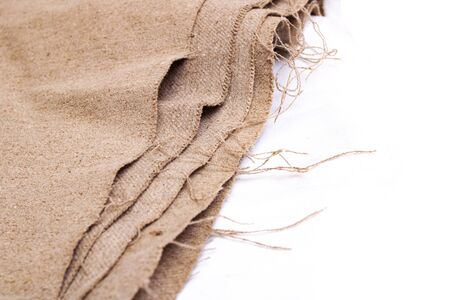 Gray burlap cloth close up on white backgroundの写真素材