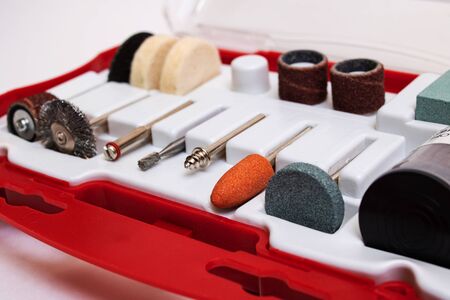 Set of nozzles for an engraver in a plastic box on a white background close up