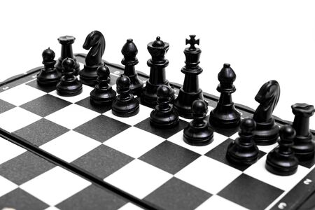 Black side of chess on a white background close upの写真素材
