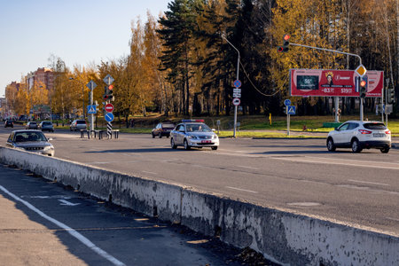 BELARUS, NOVOPOLOTSK - SEPTEMBER 29, 2019: Police car on a wide empty roadのeditorial素材